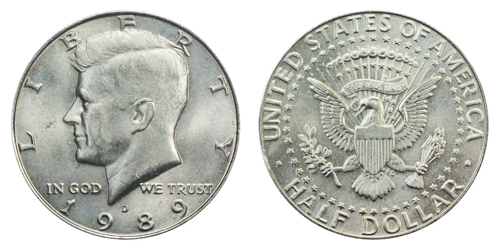 Close-up of 1989-D Kennedy half dollar RPM-001 repunched mint mark showing doubled D with counter-clockwise offset impression