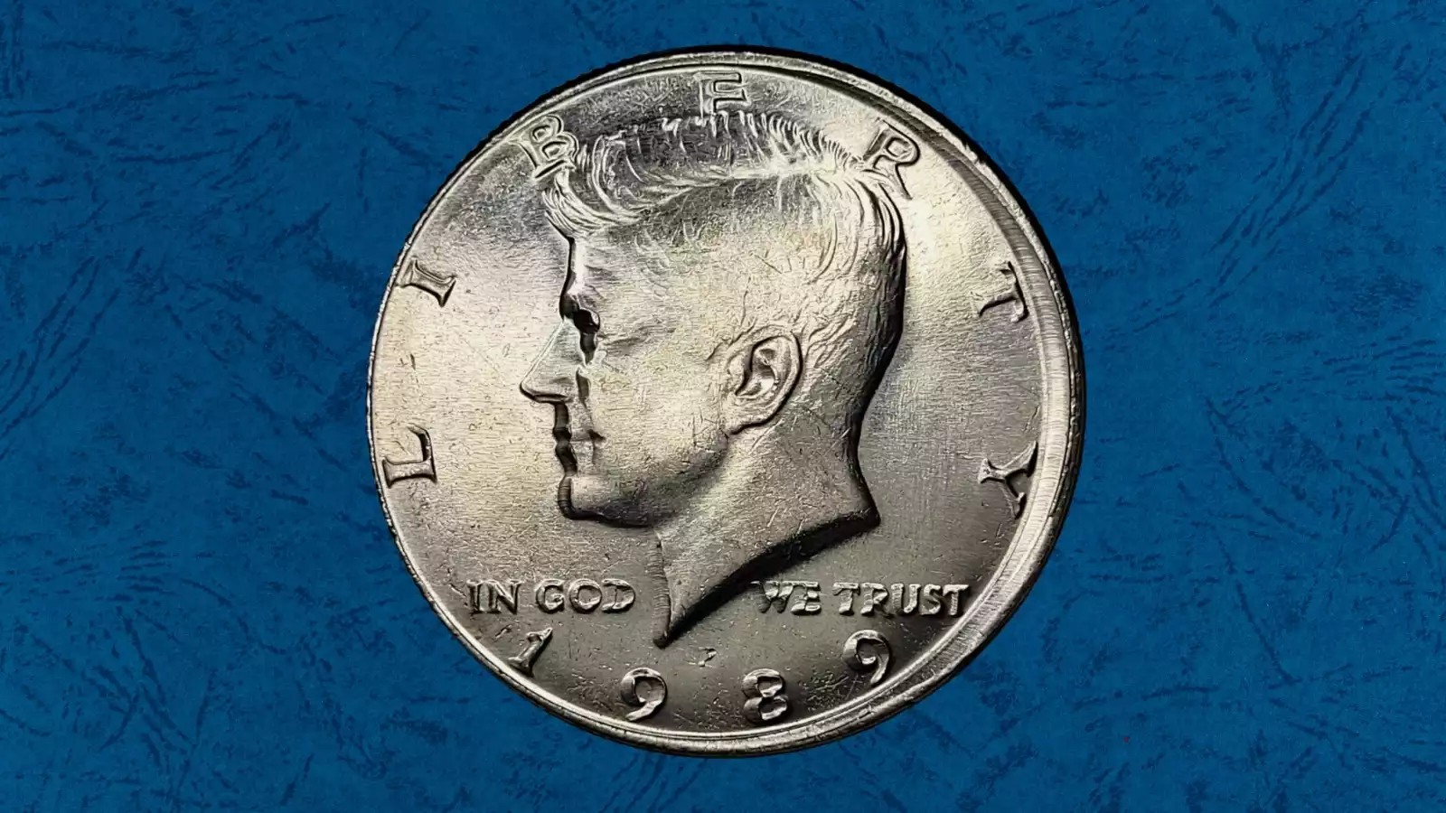 1989 Kennedy half dollar showing rotated die error with reverse eagle design rotated approximately 90 degrees clockwise relative to normal medal alignment